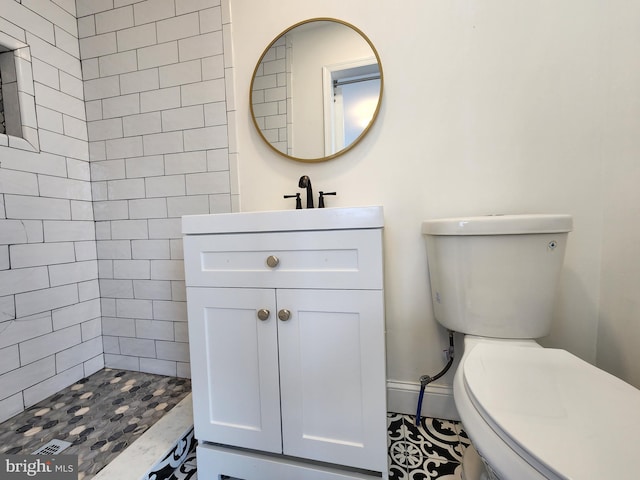 1261 Gallatin St NE, Washington, DC 20017 - bathroom with toilet, a tile shower, and vanity
