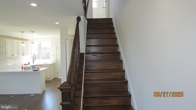 1261 Gallatin St NE, Washington, DC 20017 - staircase featuring recessed lighting, baseboards, and wood finished floors