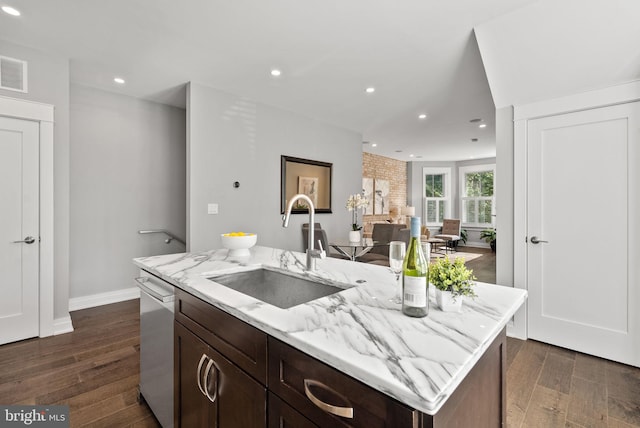 900 11th St NE Unit 1, Washington, DC 20002 - kitchen with dark wood finished floors, a sink, dishwasher, light stone countertops, and dark brown cabinets