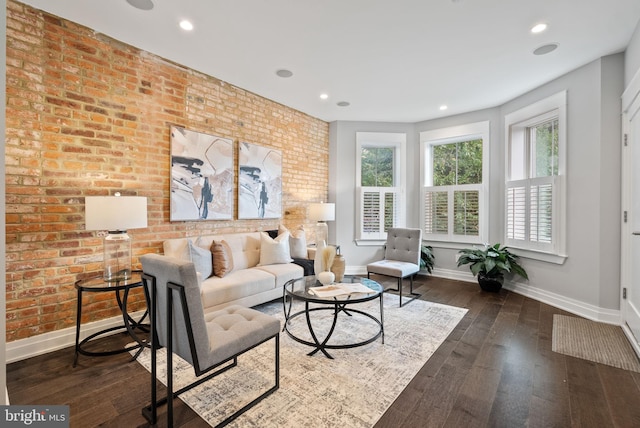 900 11th St NE Unit 1, Washington, DC 20002 - living area featuring dark wood-type flooring, baseboards, recessed lighting, and brick wall