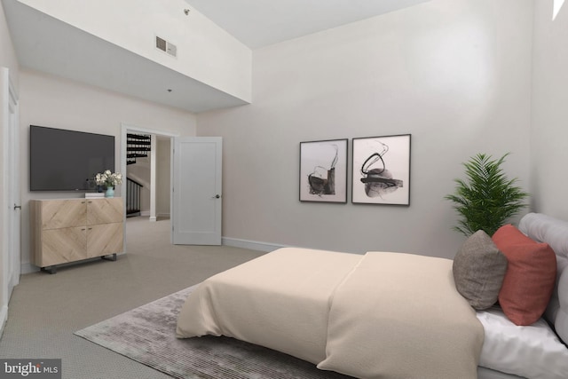 201 N 8th St Unit 105, Philadelphia, PA 19106 - bedroom with light carpet, baseboards, and a high ceiling
