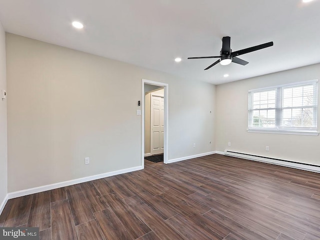 spare room featuring baseboards, a baseboard radiator, a ceiling fan, recessed lighting, and dark wood-type flooring