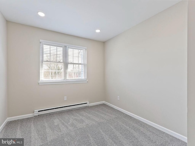 spare room with recessed lighting, carpet, a baseboard radiator, and baseboards