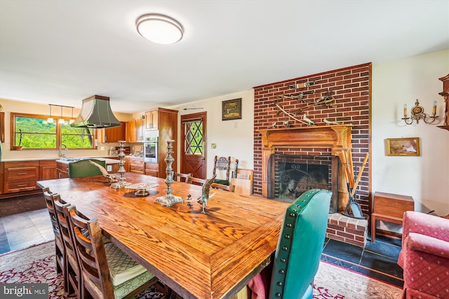 dining area with a brick fireplace