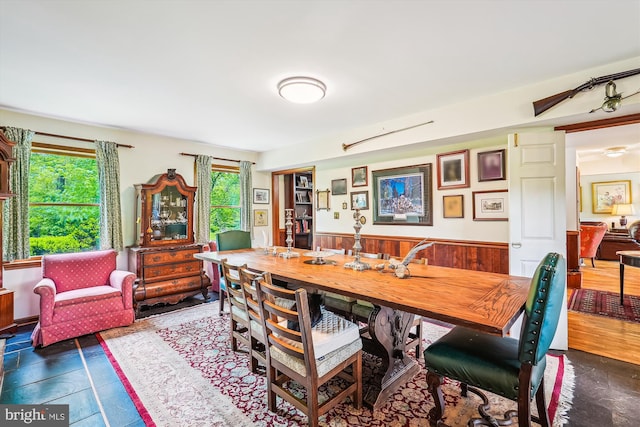 dining area featuring wainscoting