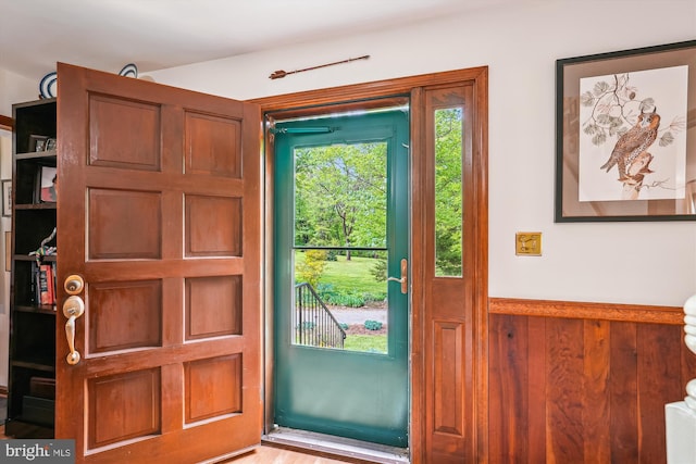 doorway with a wainscoted wall