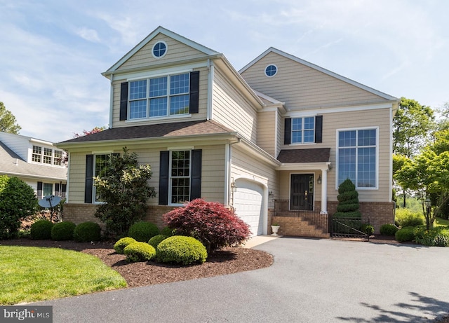 5464 Cherry Hill Ln, Salisbury, MD 21801 - view of front of house featuring brick siding, asphalt driveway, and an attached garage