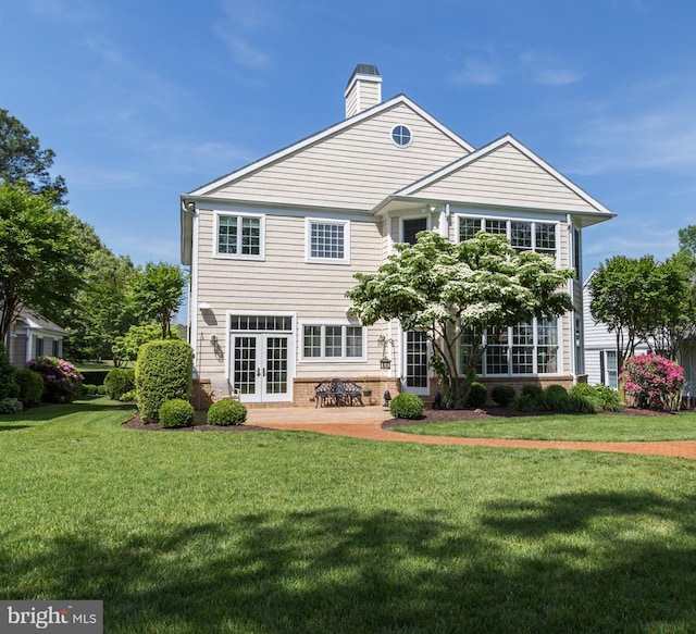 5464 Cherry Hill Ln, Salisbury, MD 21801 - rear view of property with french doors, a yard, a chimney, and a patio area