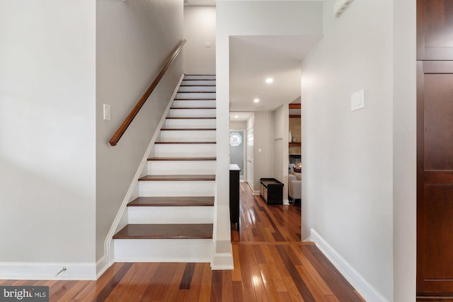 stairs with hardwood / wood-style flooring, recessed lighting, and baseboards