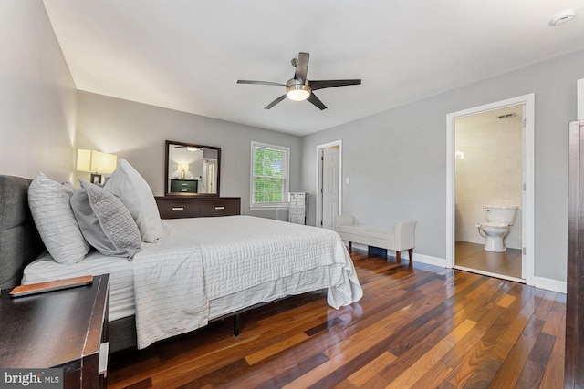 bedroom with wood finished floors, baseboards, a ceiling fan, and ensuite bath