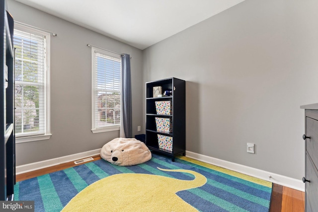 playroom featuring wood finished floors and baseboards