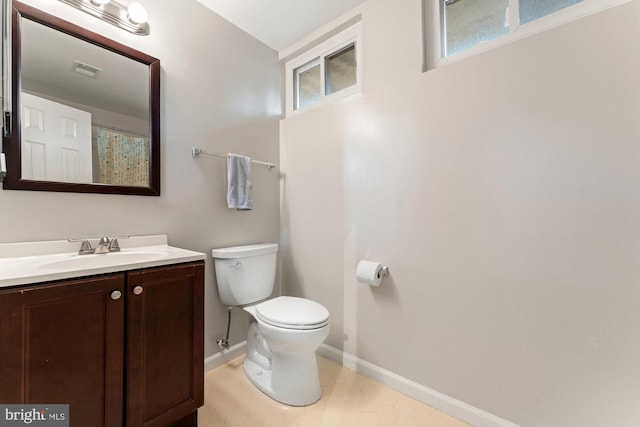 full bath with baseboards, toilet, and vanity