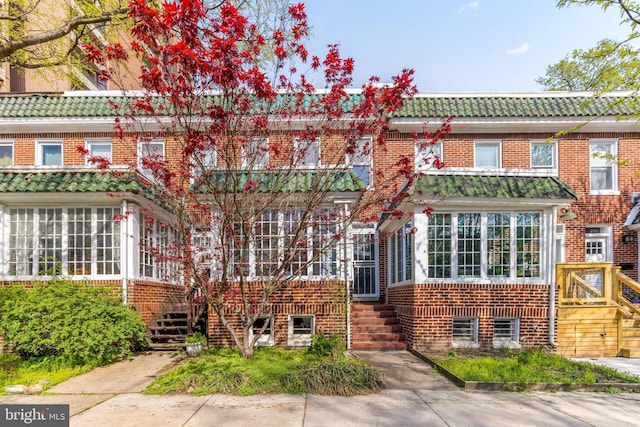 view of front of home featuring brick siding