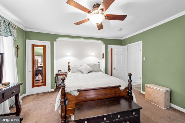 carpeted bedroom with crown molding, baseboards, and a ceiling fan