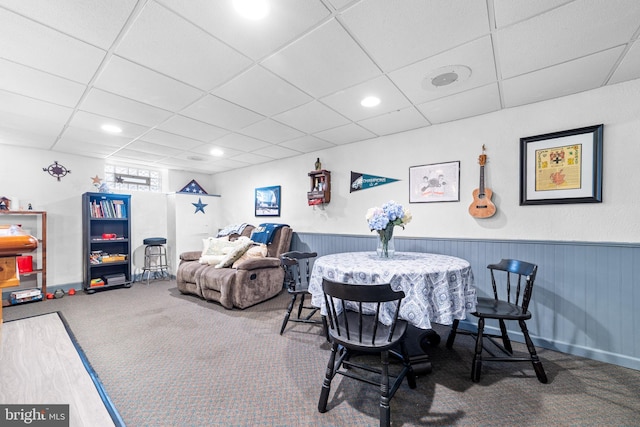 dining area featuring a paneled ceiling, recessed lighting, carpet, and a wainscoted wall