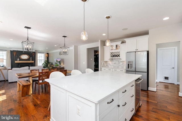 187 Verbena Dr, Stafford, VA 22554 - kitchen with stainless steel fridge with ice dispenser, decorative backsplash, white cabinets, dark wood-type flooring, and recessed lighting