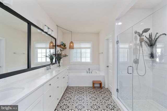 187 Verbena Dr, Stafford, VA 22554 - bathroom featuring a shower stall, a bath, and double vanity