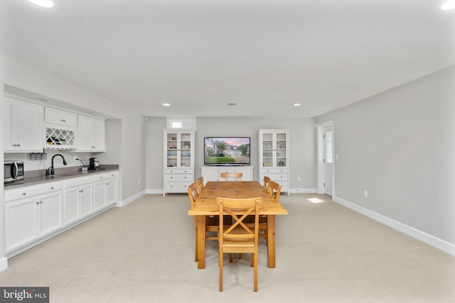 187 Verbena Dr, Stafford, VA 22554 - dining space featuring light carpet, baseboards, recessed lighting, and bar with sink