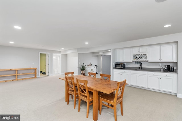 187 Verbena Dr, Stafford, VA 22554 - dining room with wet bar, light colored carpet, and recessed lighting
