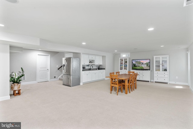 187 Verbena Dr, Stafford, VA 22554 - dining space with light carpet, stairway, baseboards, and recessed lighting