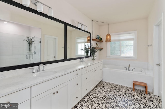 187 Verbena Dr, Stafford, VA 22554 - full bathroom with a garden tub, double vanity, and a stall shower