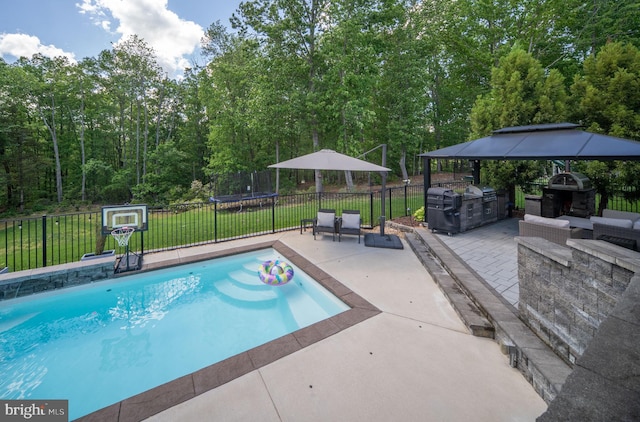 187 Verbena Dr, Stafford, VA 22554 - view of swimming pool with area for grilling, a patio, a gazebo, and an outdoor stone fireplace