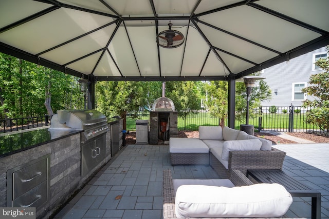 187 Verbena Dr, Stafford, VA 22554 - view of patio featuring a gazebo, area for grilling, fence, and exterior kitchen