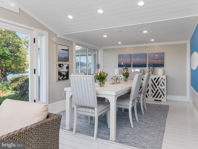 dining room featuring a healthy amount of sunlight, baseboards, ornamental molding, and recessed lighting