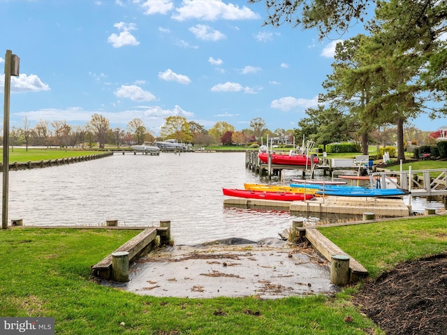 view of community with a water view, a boat dock, and a yard