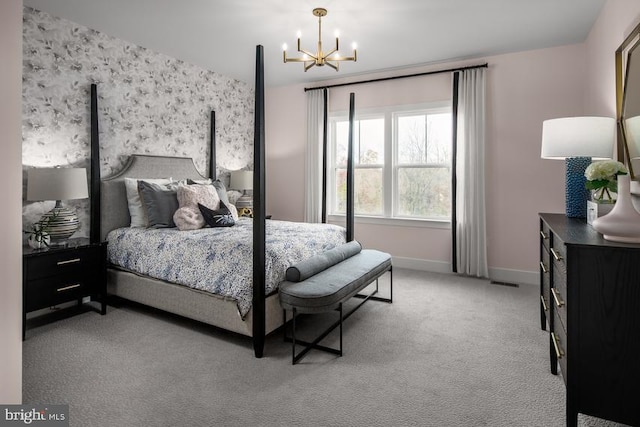 carpeted bedroom with baseboards, wallpapered walls, and a chandelier