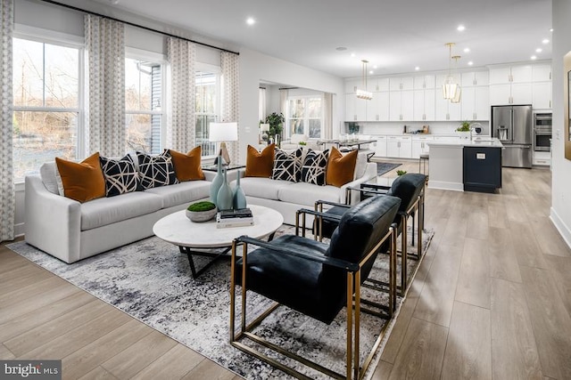 living room featuring recessed lighting and light wood-style floors