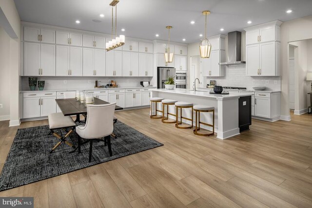 dining space featuring recessed lighting, baseboards, and light wood-type flooring