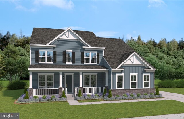 craftsman inspired home featuring a shingled roof, a front lawn, board and batten siding, and a porch