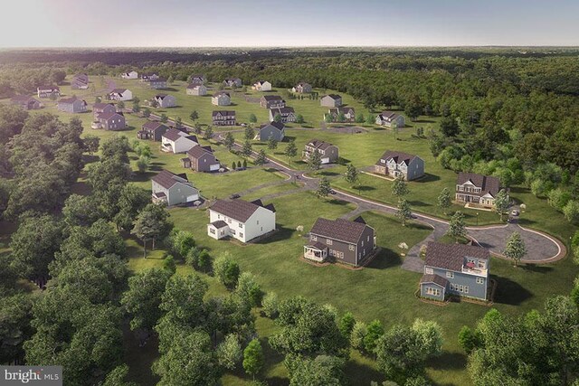 aerial view featuring a wooded view
