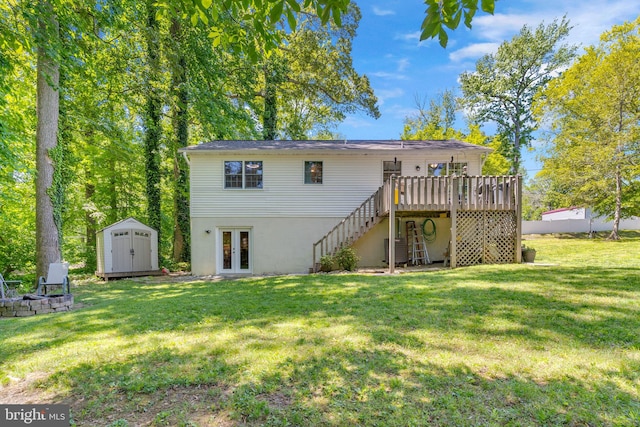 back of house with french doors, stairs, a shed, an outdoor fire pit, and a wooden deck