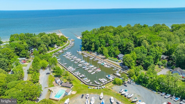 aerial overview of property's location with a nearby body of water and numerous boat docks