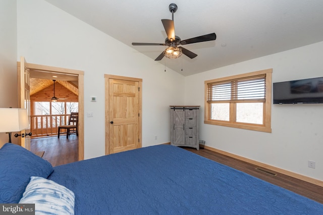 unfurnished bedroom with ceiling fan, visible vents, wood finished floors, and lofted ceiling