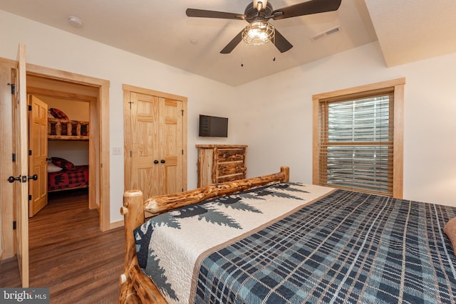 bedroom with wood finished floors, a closet, ceiling fan, and visible vents