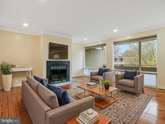 7212 Donnell Pl Unit D5, District Heights, MD 20747 - living room featuring crown molding, baseboards, hardwood / wood-style floors, and a fireplace with flush hearth