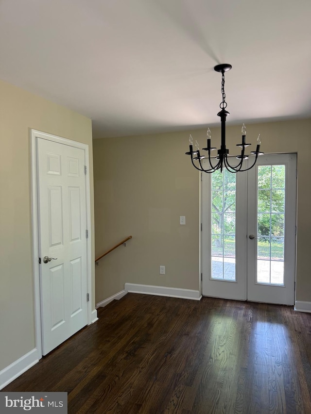 18820 Kerill Rd, Triangle, VA 22172 - empty room with a chandelier and dark wood finished floors