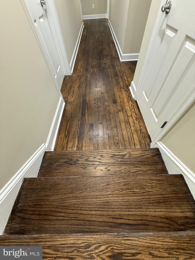 18820 Kerill Rd, Triangle, VA 22172 - hall with dark wood-style floors and stairway