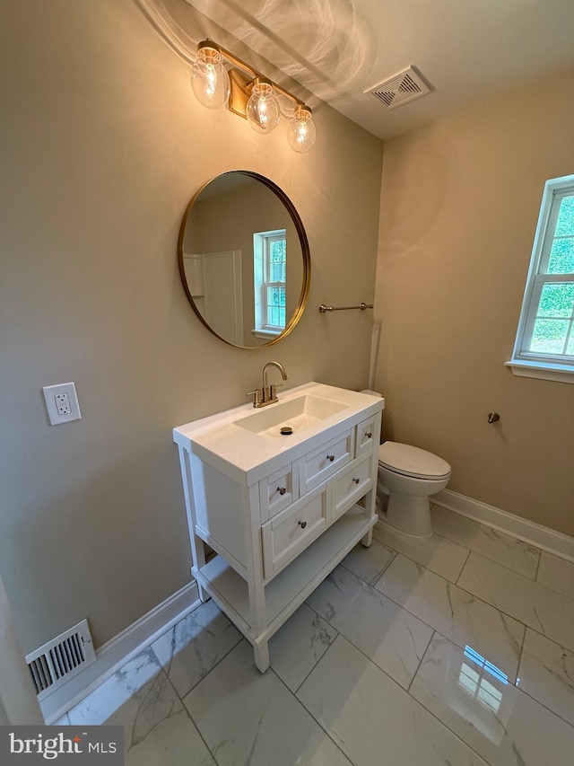 18820 Kerill Rd, Triangle, VA 22172 - bathroom featuring marble look tile flooring and vanity