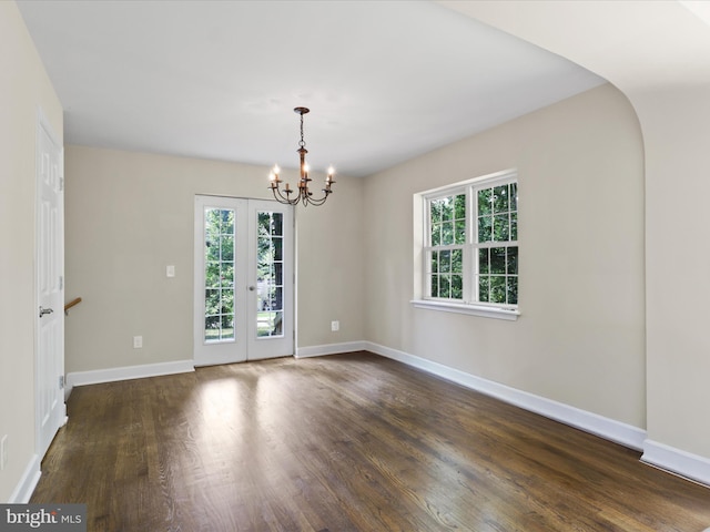 18820 Kerill Rd, Triangle, VA 22172 - spare room with dark wood finished floors, a chandelier, french doors, and arched walkways