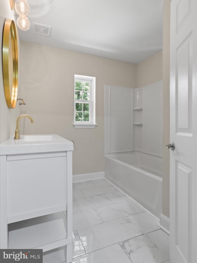 18820 Kerill Rd, Triangle, VA 22172 - bathroom featuring marble look tiles, vanity, and shower / washtub combination