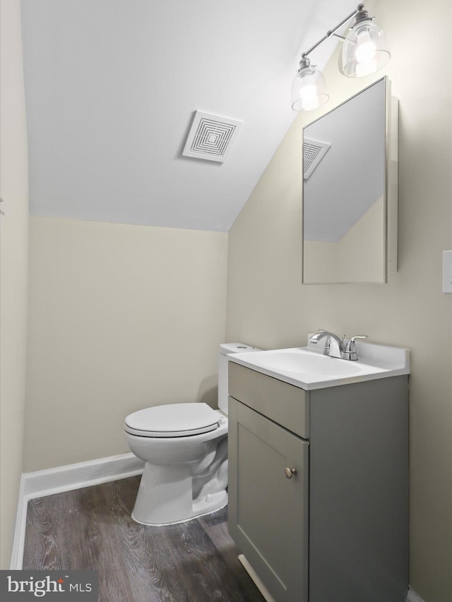 18820 Kerill Rd, Triangle, VA 22172 - bathroom with wood finished floors, vanity, and vaulted ceiling