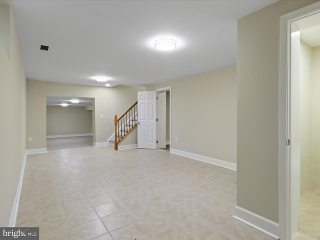 18820 Kerill Rd, Triangle, VA 22172 - finished below grade area featuring stairway and light tile patterned flooring