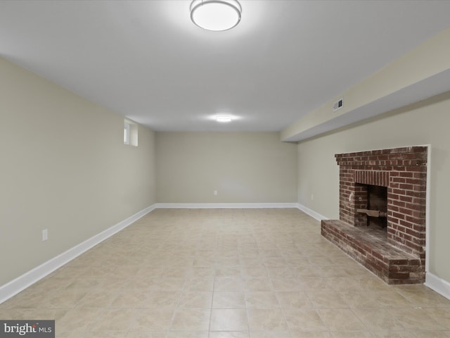 18820 Kerill Rd, Triangle, VA 22172 - unfurnished living room with light tile patterned floors and a brick fireplace