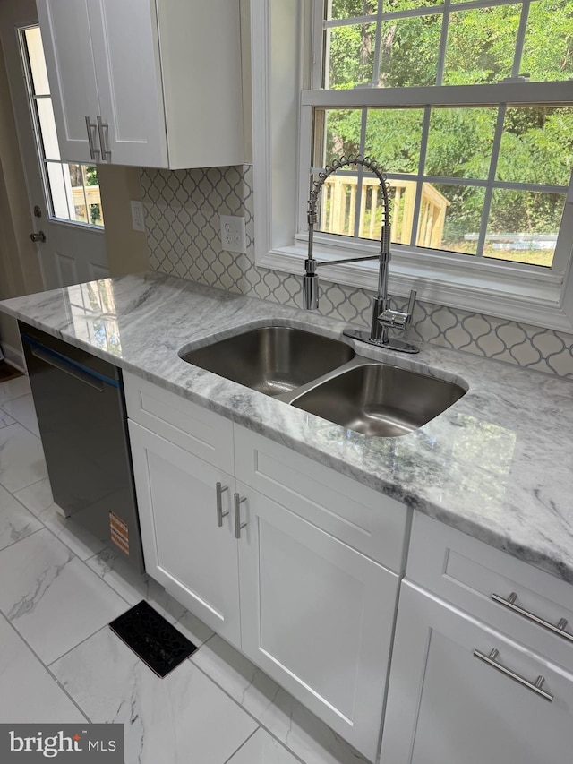 18820 Kerill Rd, Triangle, VA 22172 - kitchen featuring dishwasher, light marble finish floors, white cabinetry, and backsplash