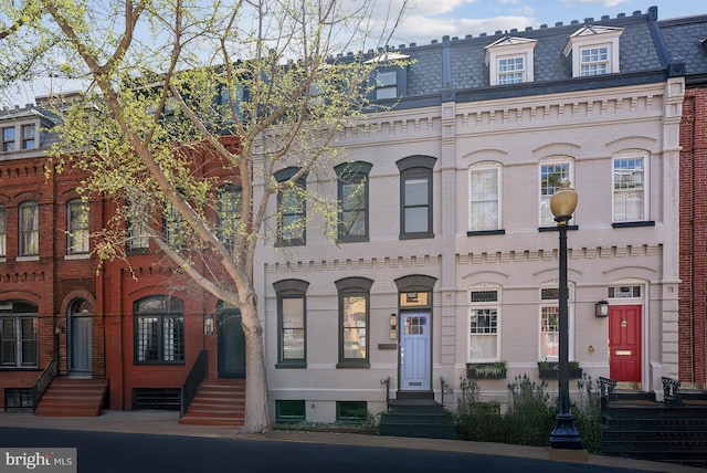 1526 Swann St NW, Washington, DC 20009 - view of front of home featuring entry steps, mansard roof, brick siding, and a high end roof