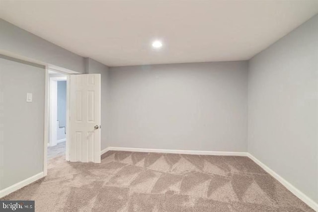 finished basement featuring carpet flooring, baseboards, and recessed lighting